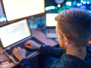 programmer-using-laptop-and-pc-information-coding.jpg